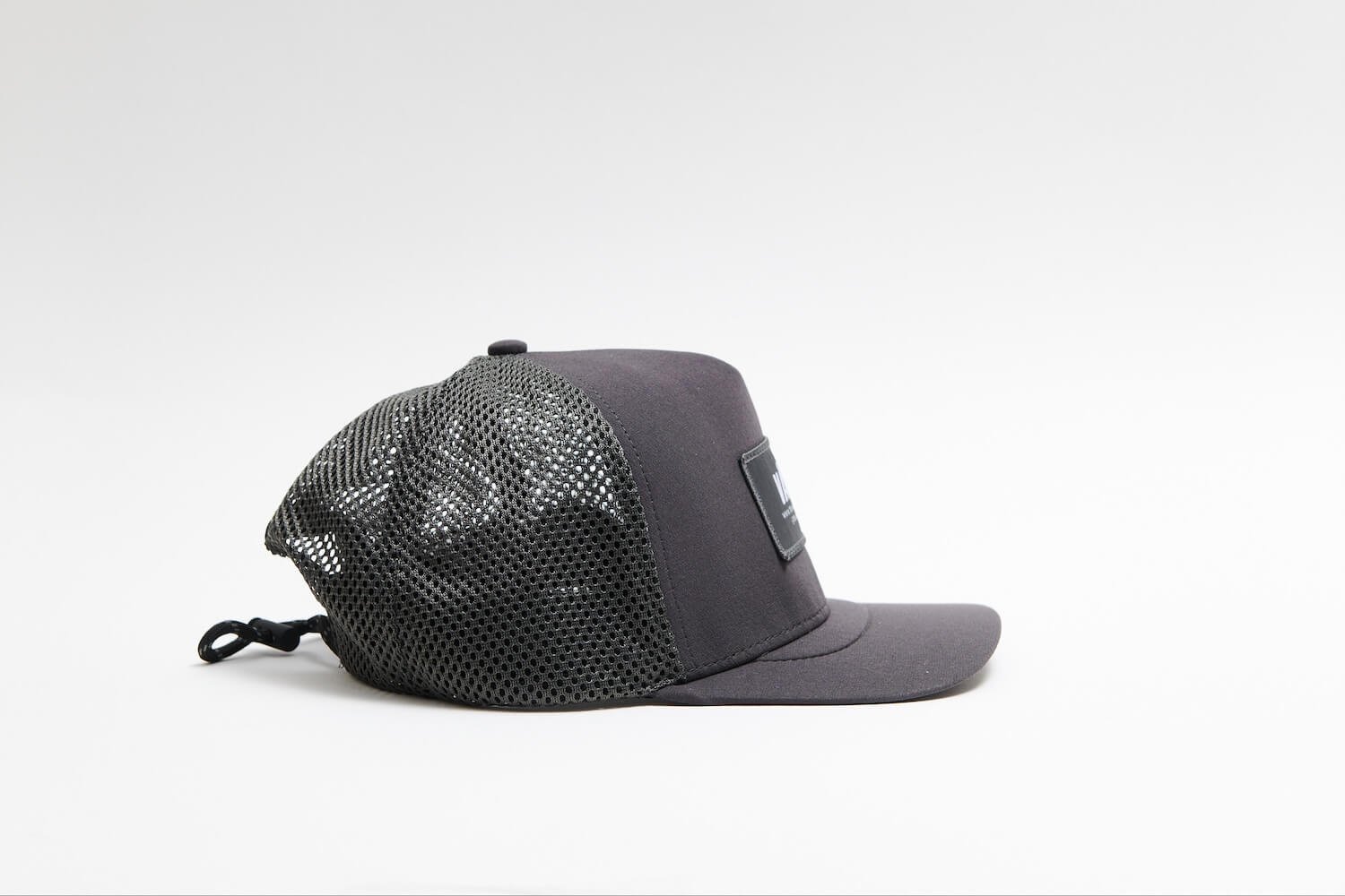 open-mesh-trucker-cap-charcoal-side.jpg