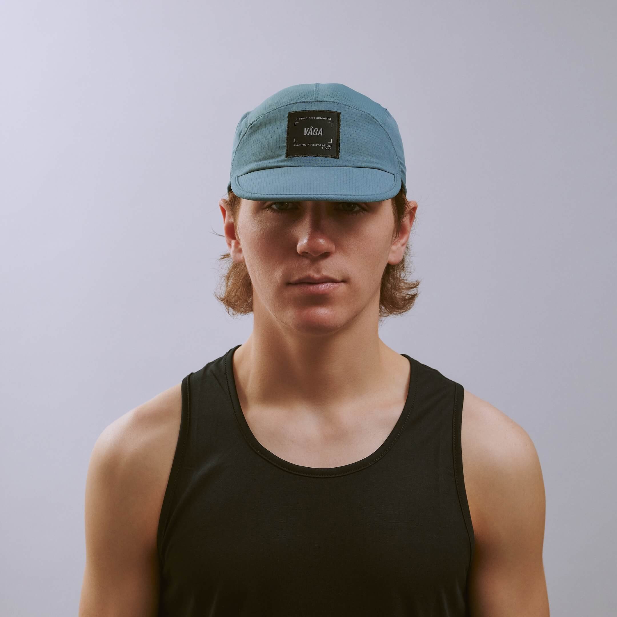 vaga-transit-lite-cap-unstructured-running-cap-teal-e-model-front.jpg