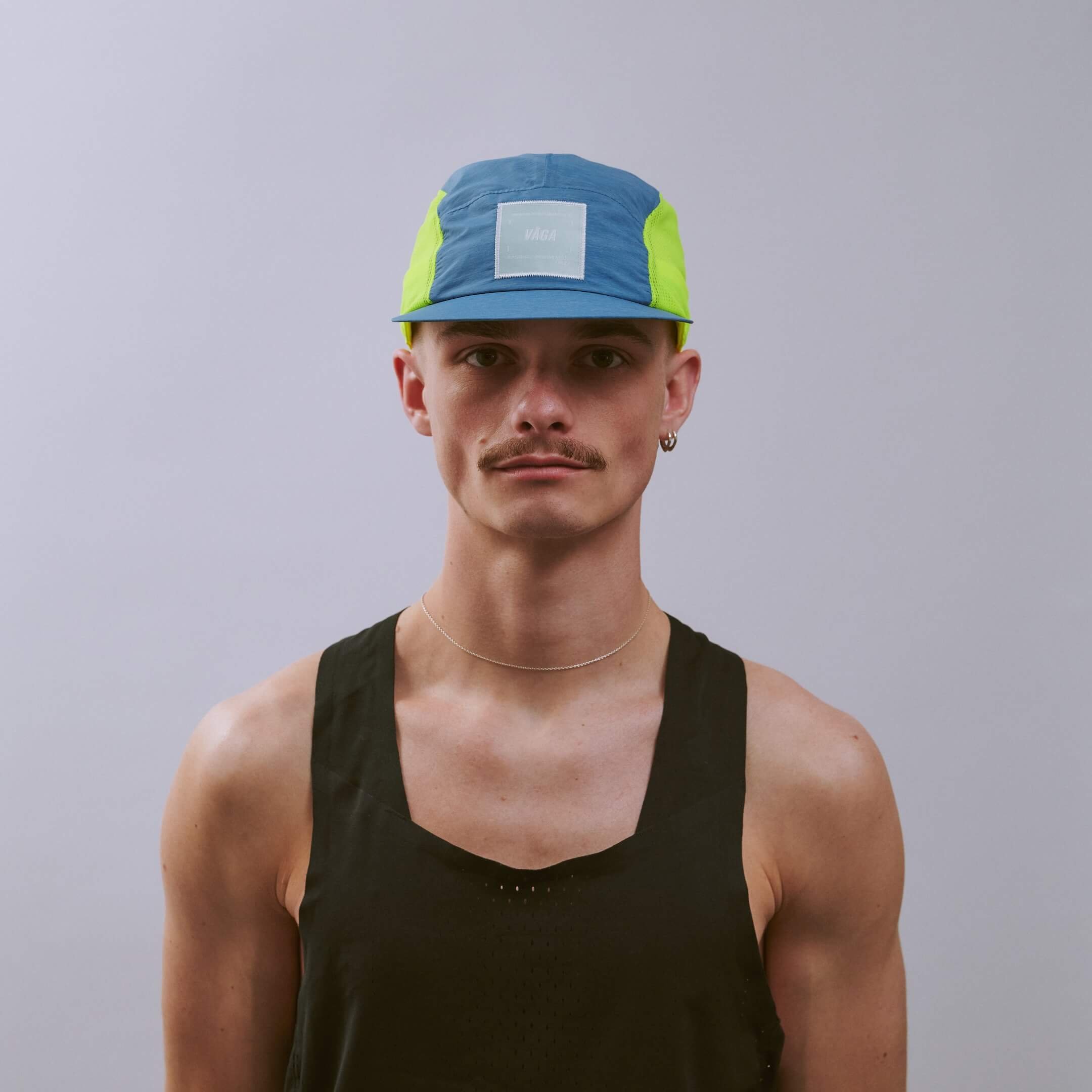 vaga-mesh-flex-running-cap-teal-neonyellow-r-model-front.jpg