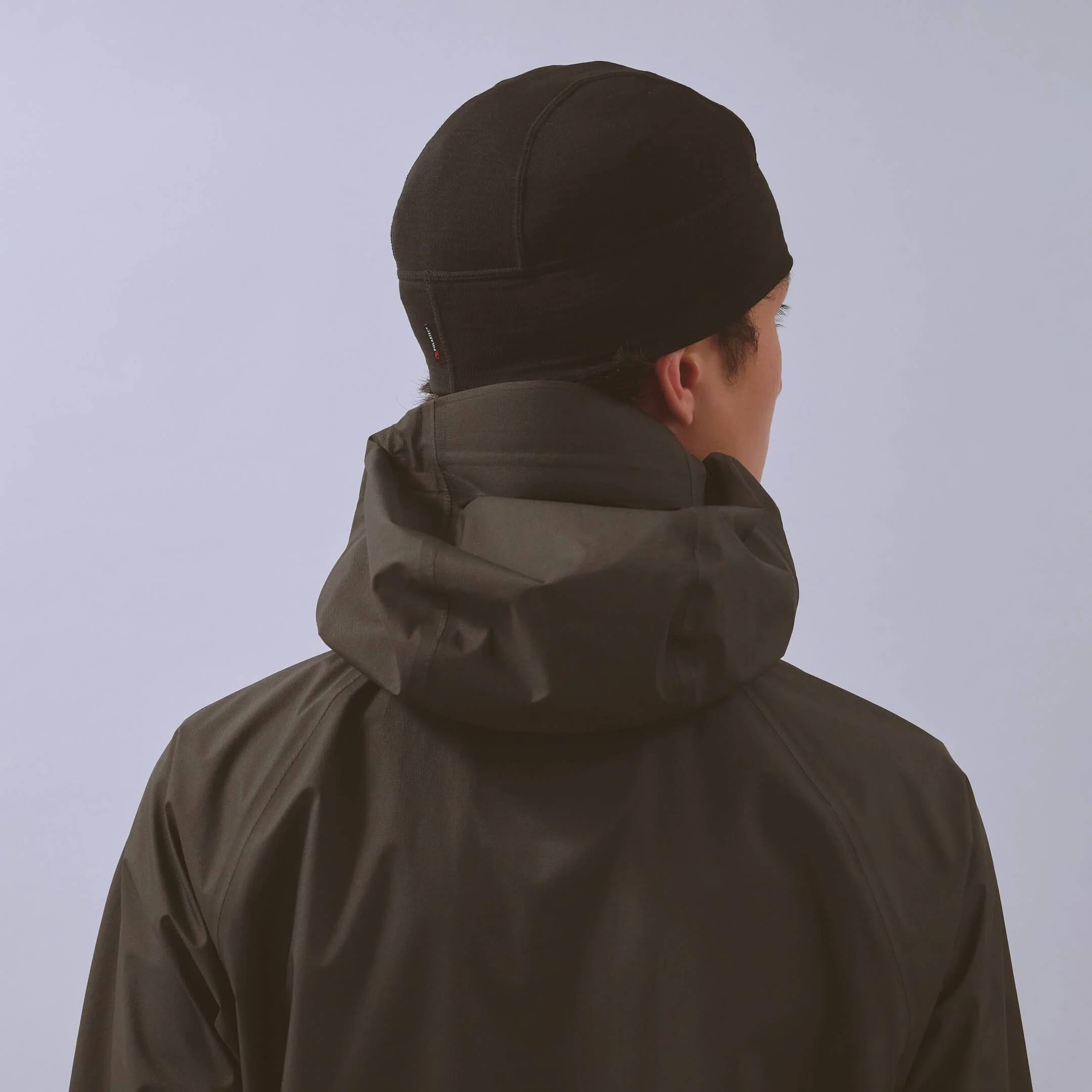 vaga-summit-performance-skull-cap-running-beanie-black-model-back-angle.jpg