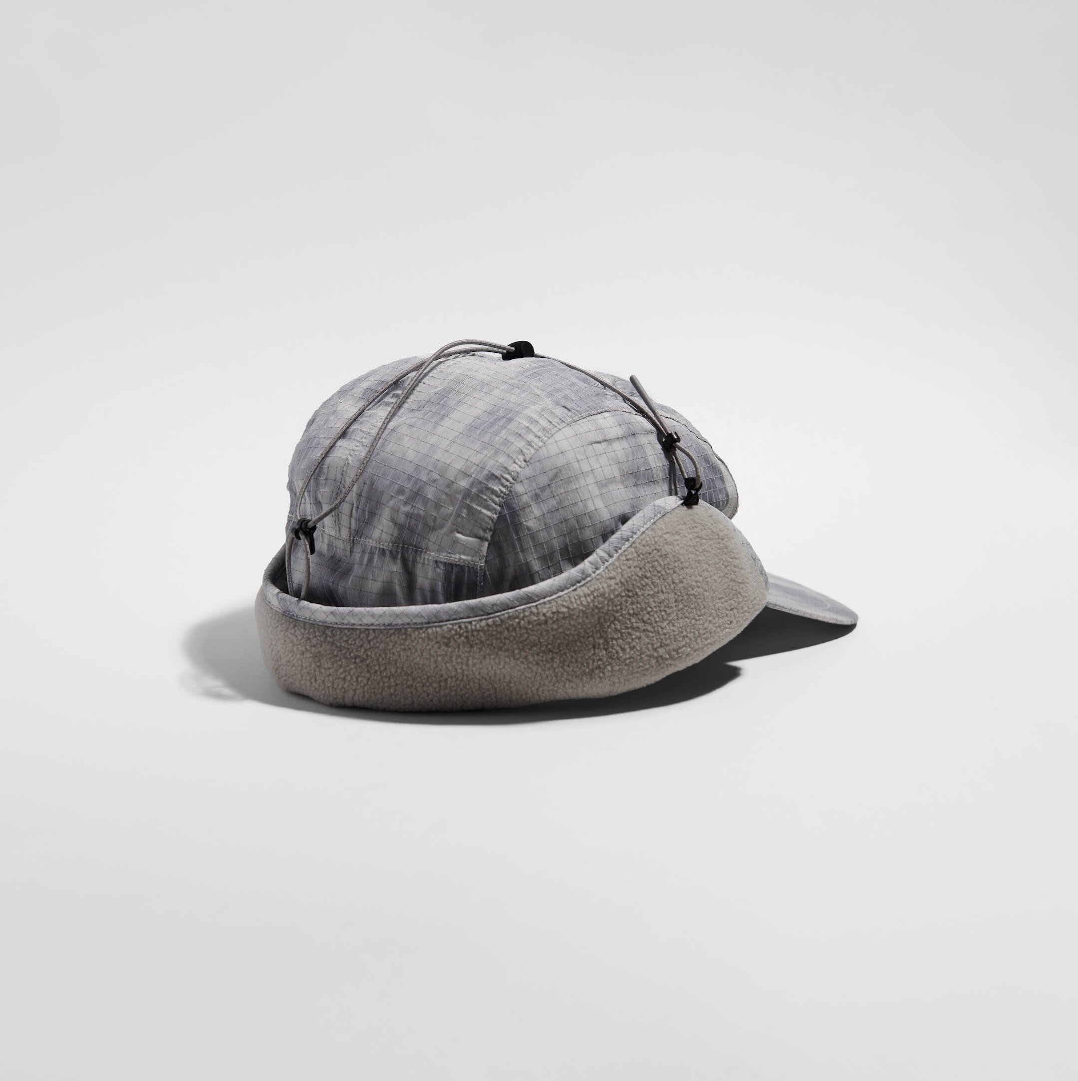 vaga-padded-hiker-cap-light-grey-silver-reflective-folded-angle.jpg
