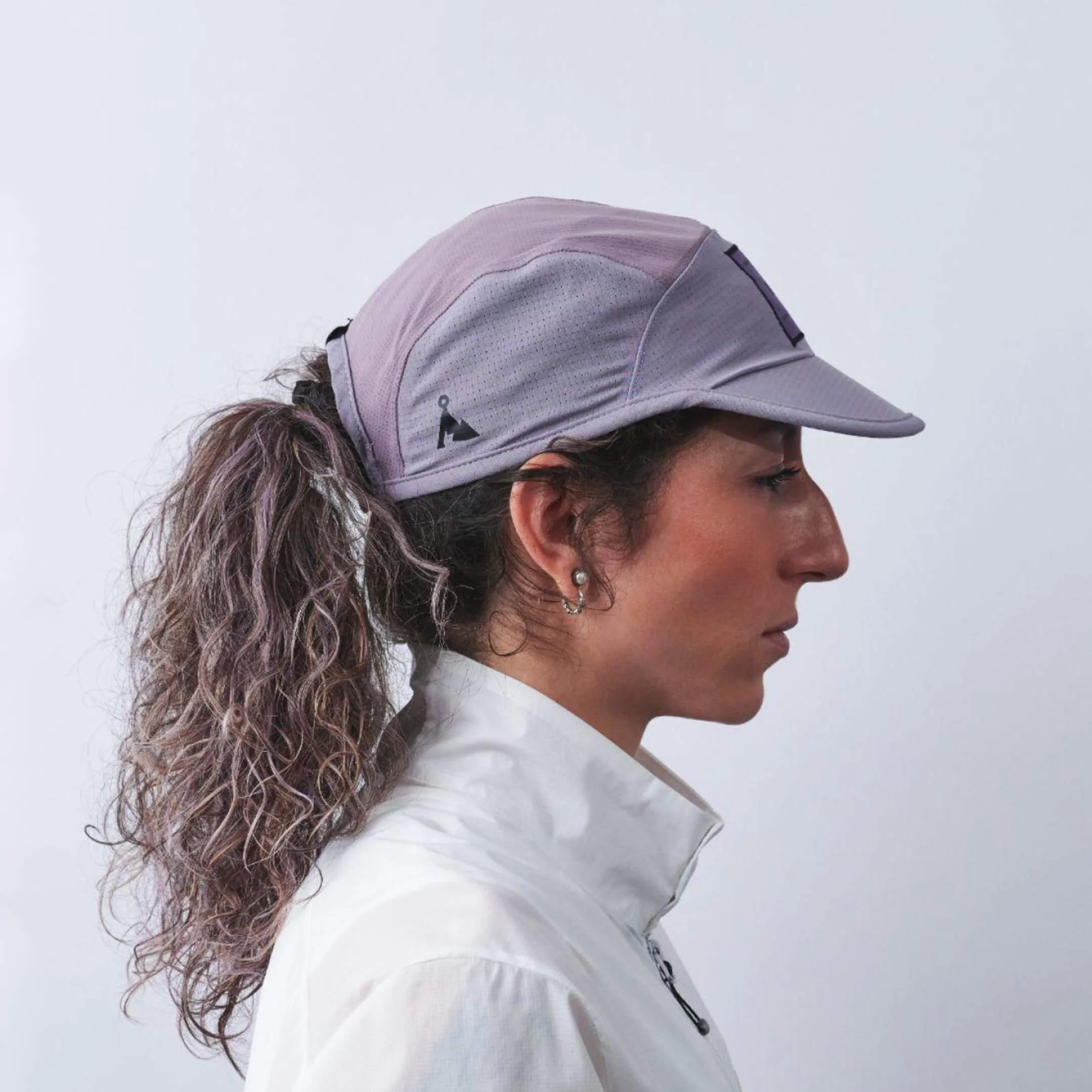 vaga-transit-lite-cap-unstructured-running-cap-mauve-model-profile.jpg