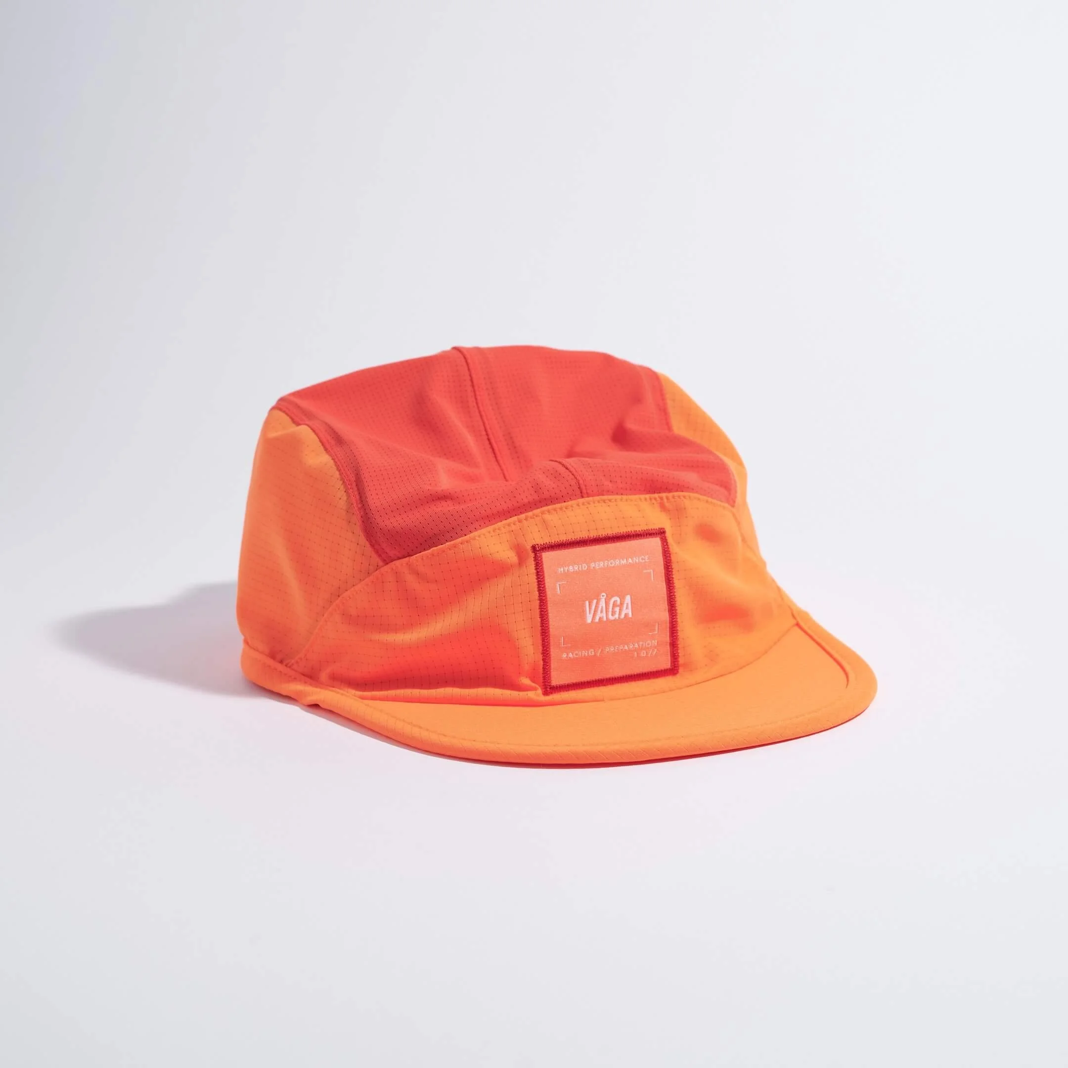 vaga-transit-lite-cap-unstructured-running-cap-neonorange-coral-angle.jpg