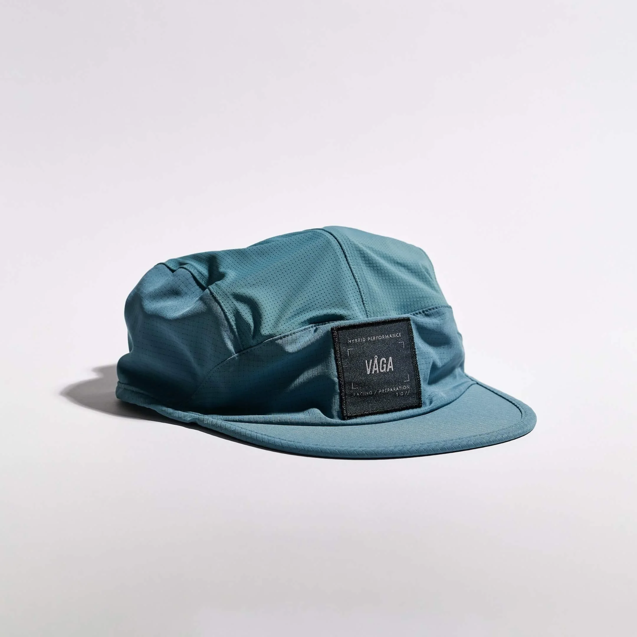 vaga-transit-lite-cap-unstructured-running-cap-teal-angle.jpg