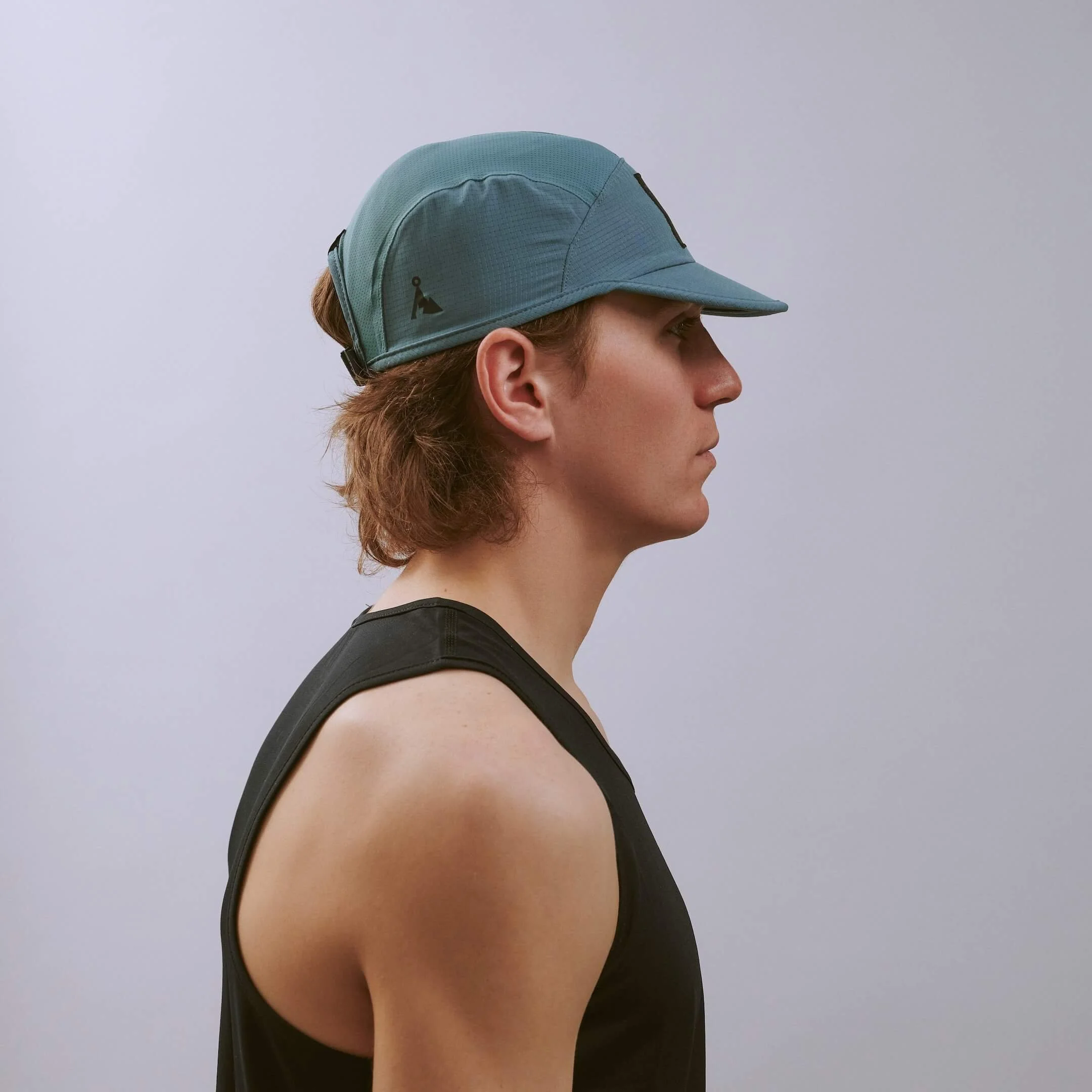 vaga-transit-lite-cap-unstructured-running-cap-teal-e-model-profile.jpg