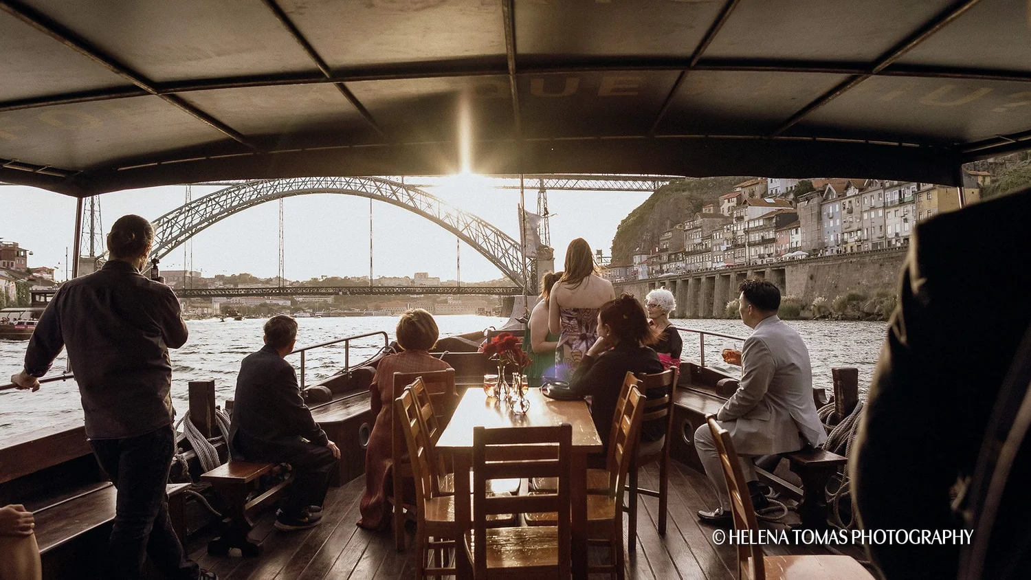Guests enjoying a sunset cruise on a private Rabelo boat