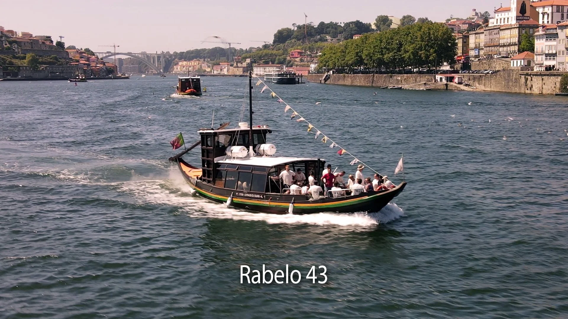 Traditional Rabelo boat cruising on the Douro River in Porto