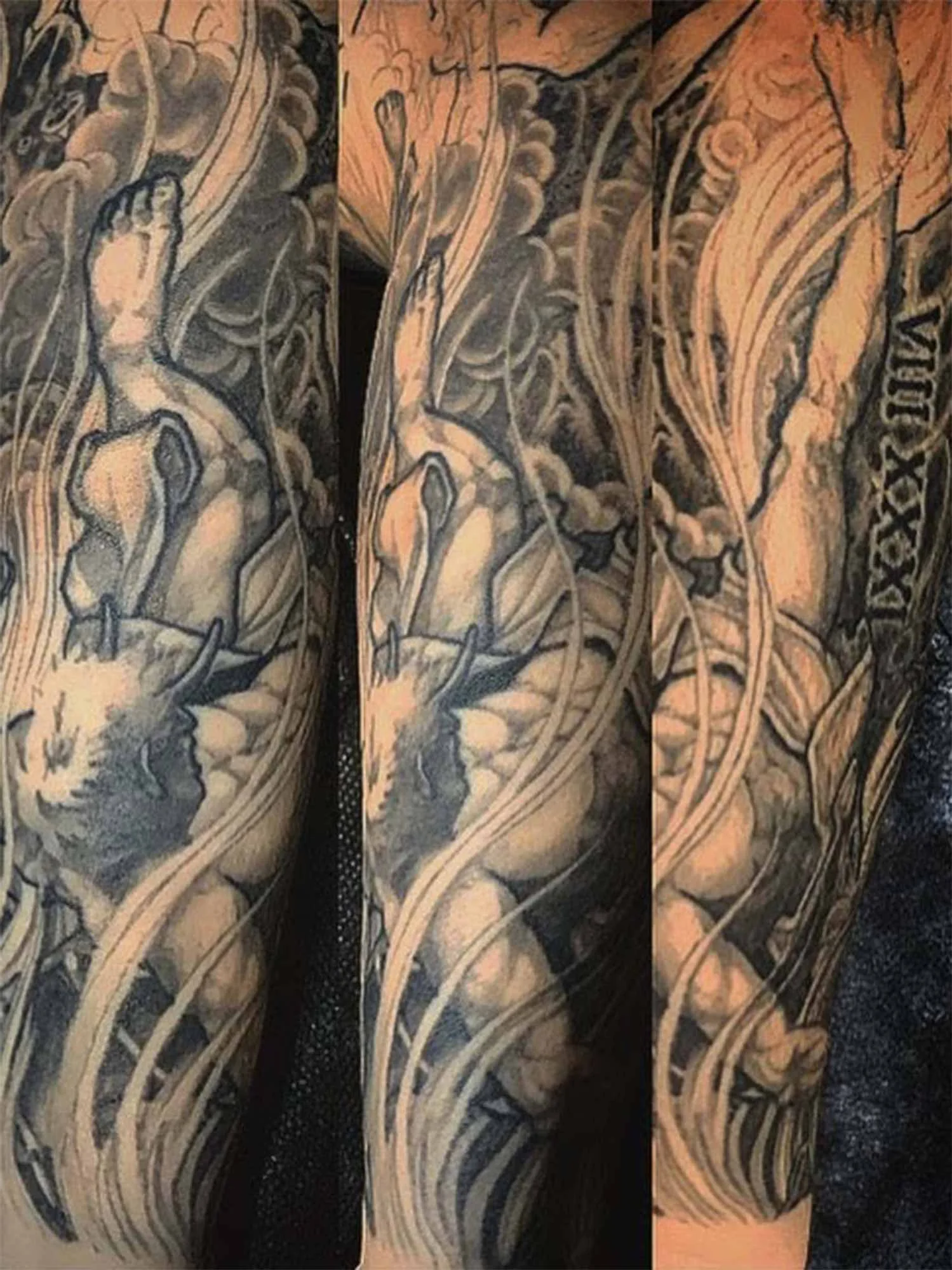  Large black and grey sleeve of a religious tattoo scene by Jason June at Bernadette Studios Upstate New York. 