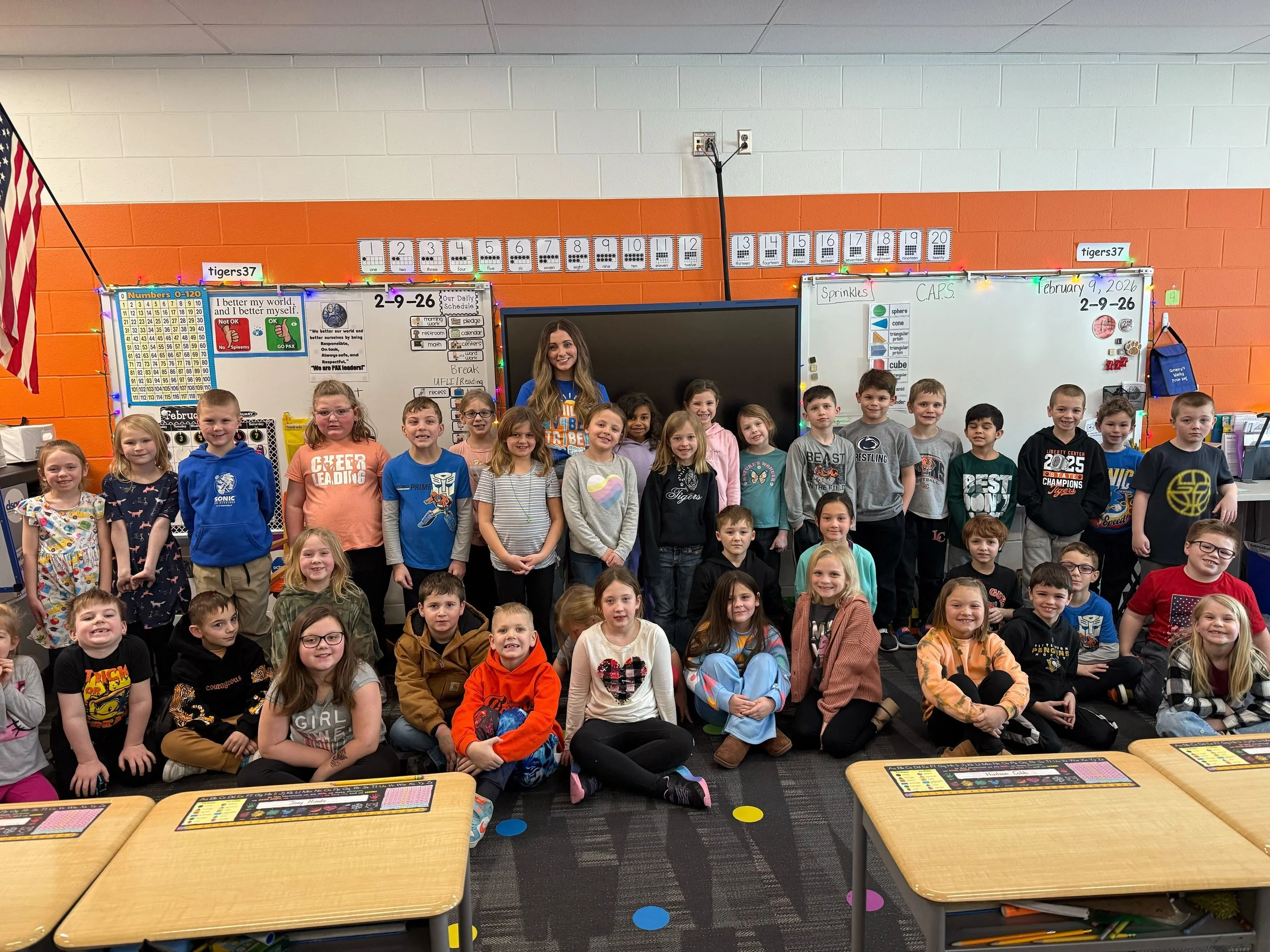 All About Kids Pediatric Dentistry team member with a large group of elementary school students during a Children's Dental Health Month school visit in Napoleon, OH