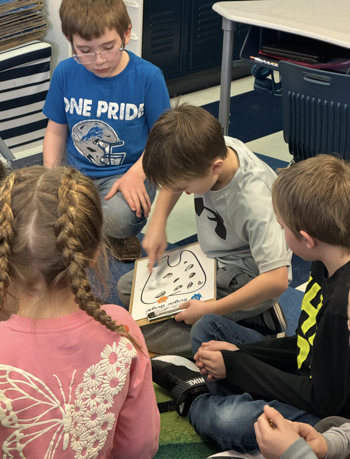 Elementary school students participating in a hands-on dental health activity during an All About Kids Pediatric Dentistry school visit