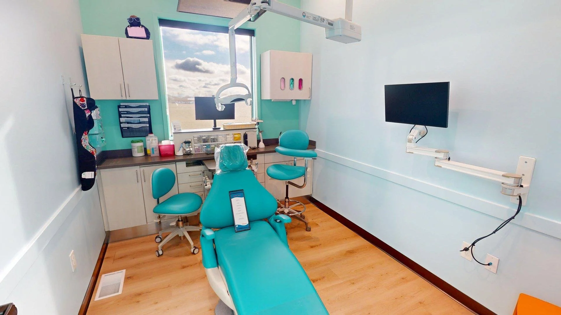 Modern pediatric dentistry exam room at All About Kids Pediatric Dentistry in Napoleon Ohio designed to keep kids comfortable and relaxed.