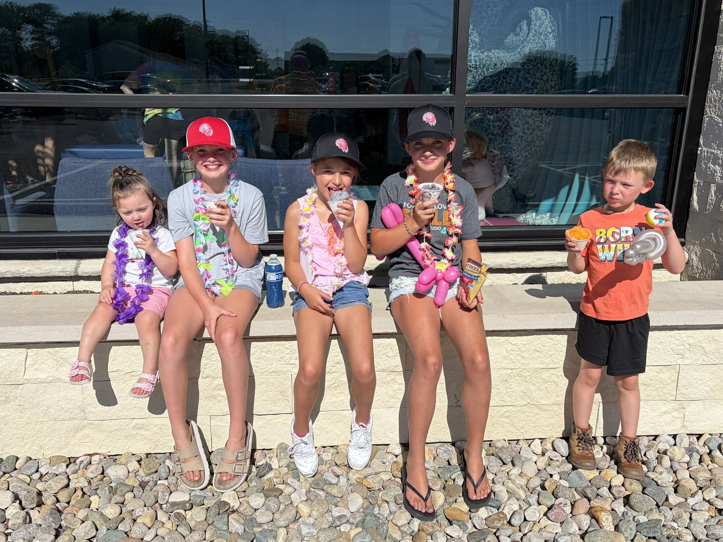 Children enjoying frozen treats during the All About Kids Pediatric Dentistry Family Fun Day community event in Napoleon, Ohio.
