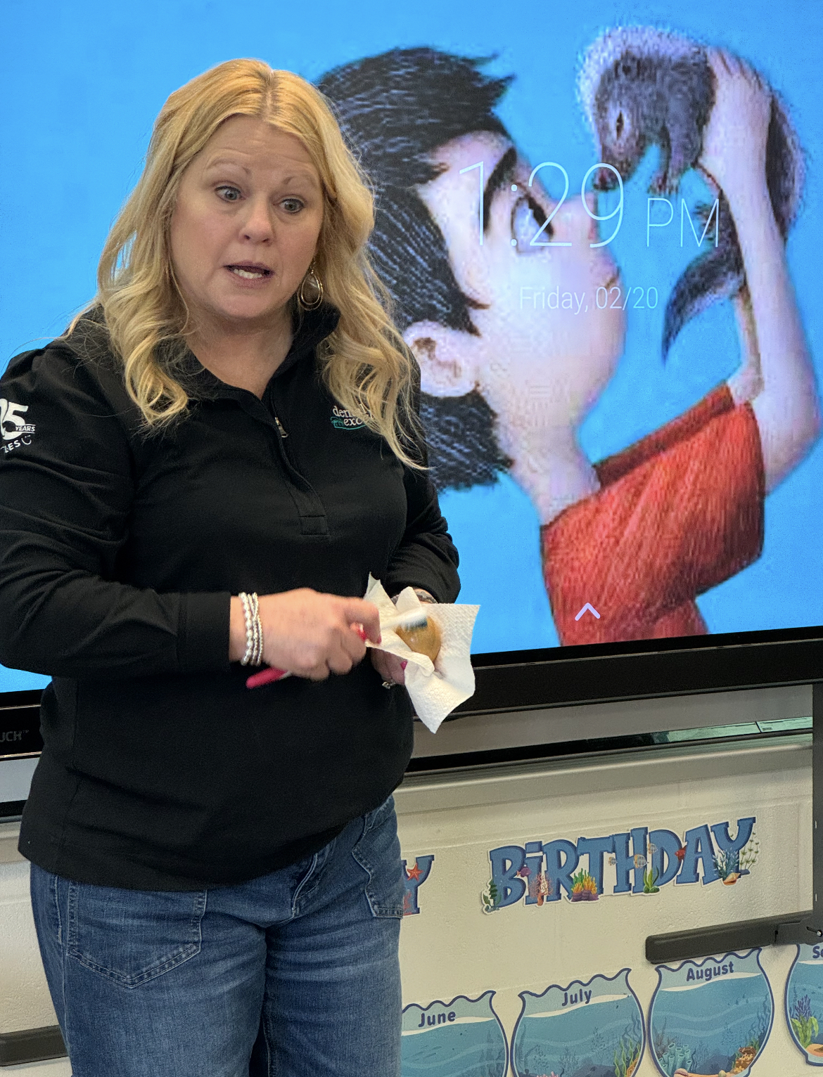 All About Kids Pediatric Dentistry team member teaching elementary school students about healthy dental habits during a classroom presentation