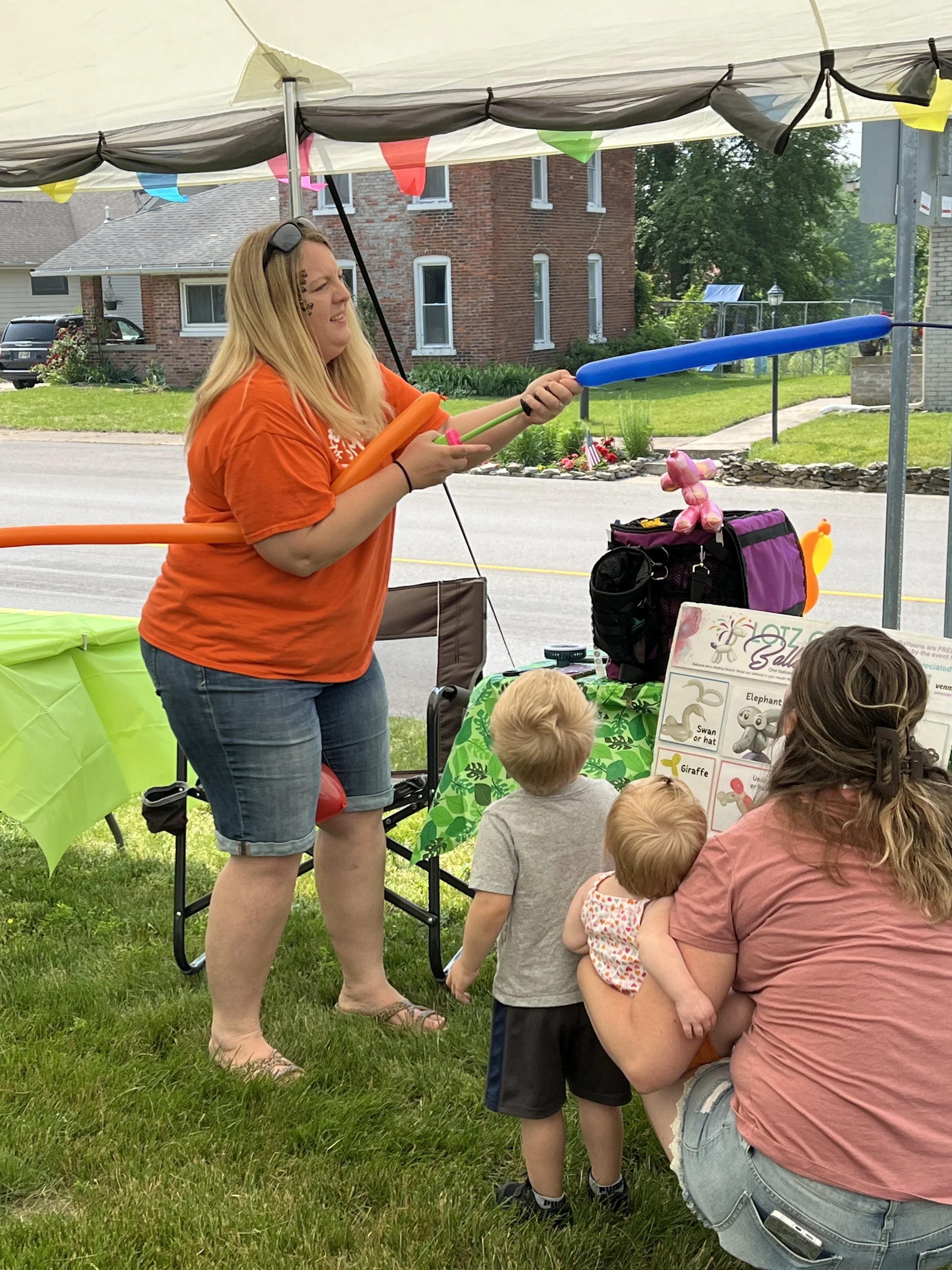 All About Kids Pediatric Dentistry team member leading a fun activity with children during Kids’ Day in Napoleon Ohio.