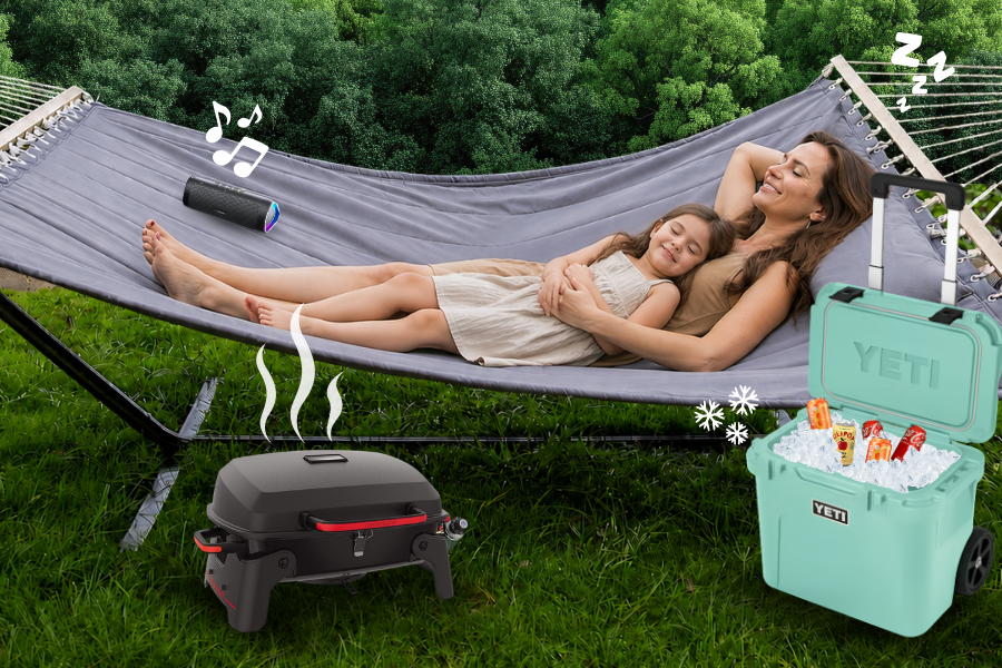 Mother and daughter relaxing in a hammock with summer giveaway prizes including a YETI cooler, tabletop grill, and Bluetooth speaker from All About Kids Pediatric Dentistry in Napoleon, Ohio.