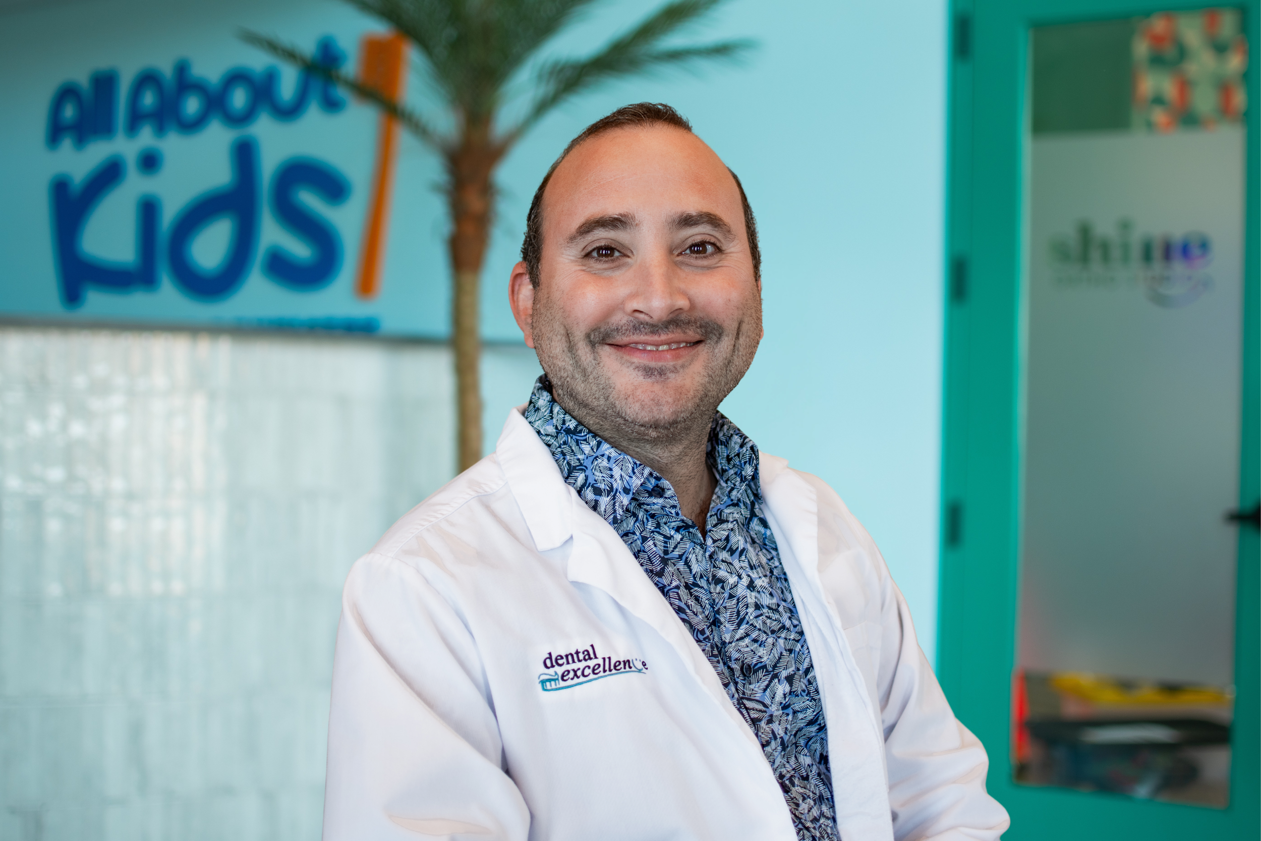 Dr. Karim Tabbaa smiling inside All About Kids Pediatric Dentistry in Napoleon, Ohio.