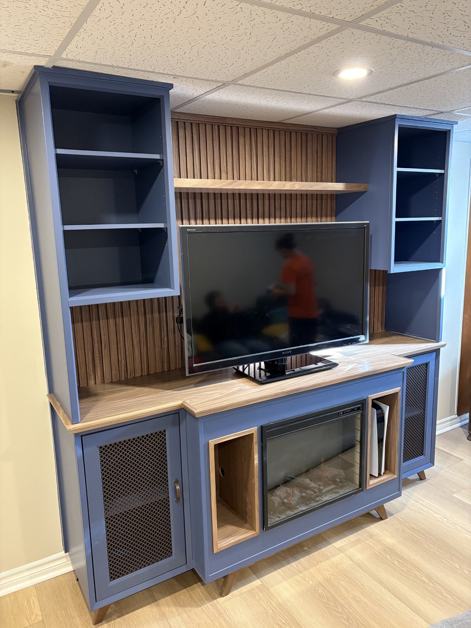 Blue media & fireplace cabinetry