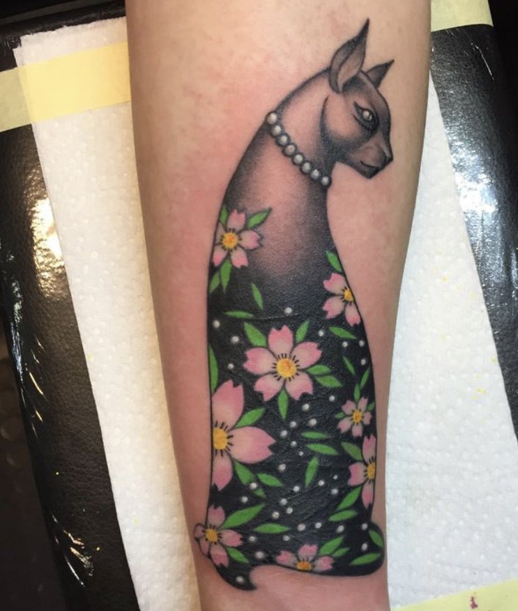 cherry blossoms and cat cover up tattoo in Vienna