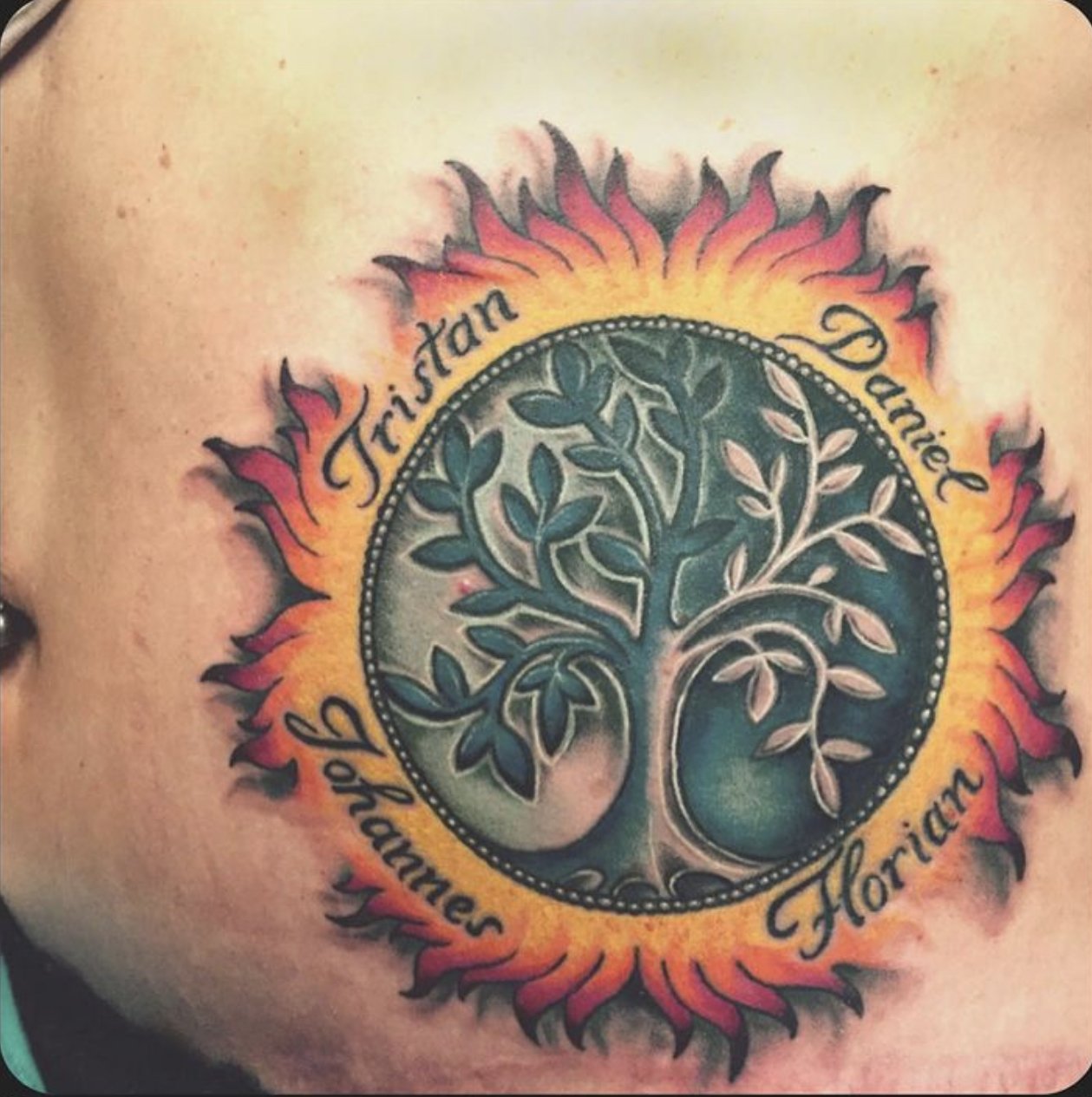 abstract sun tattoo full color custom tattoooing in wien