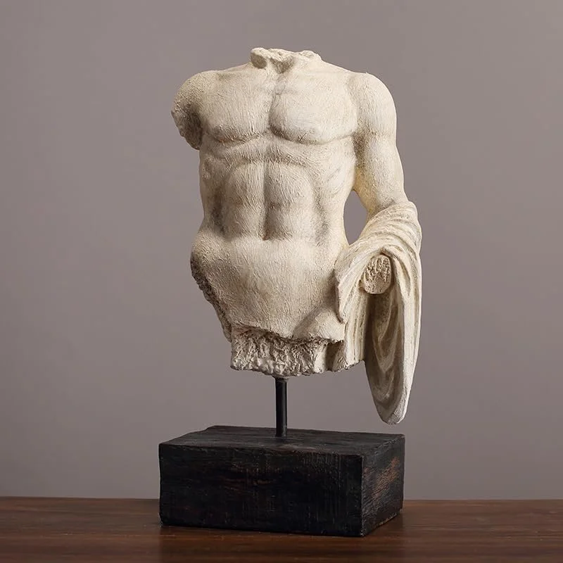 A classical marble sculpture of a male torso with missing head and limbs, mounted on a black wooden base.