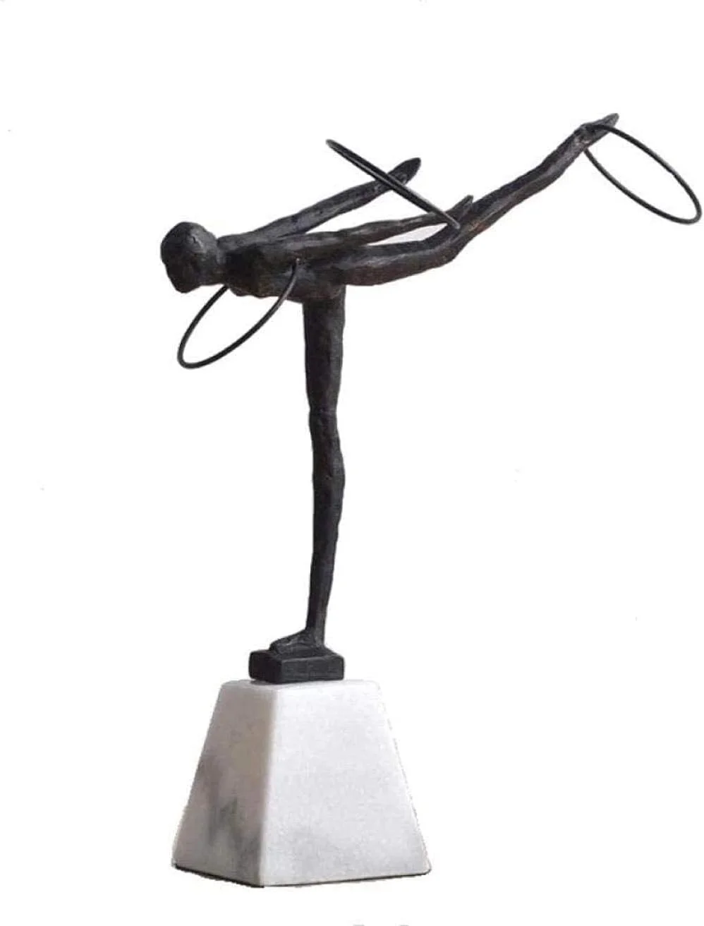 Sculpture of a gymnast in a handstand with one leg bent backward and arms supporting the body, made of dark material, mounted on a white square base.