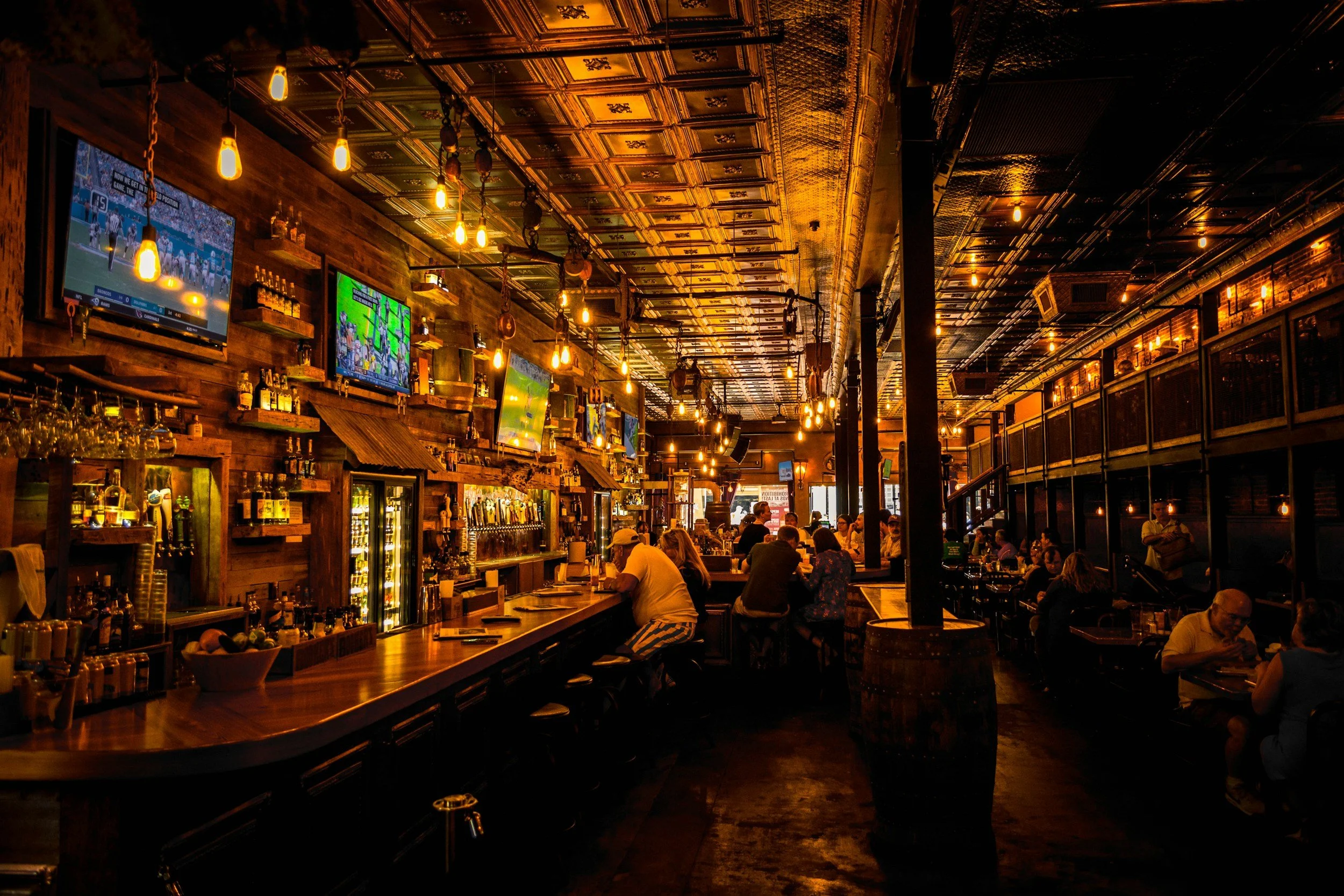 moody bar interior with old fashioned yellow lighting
