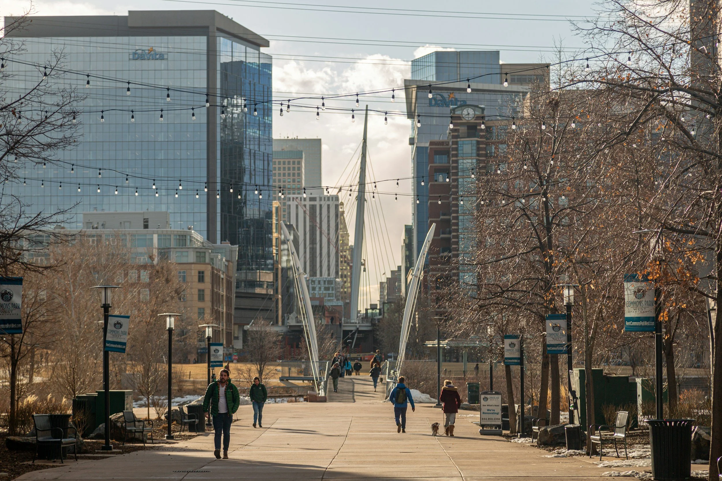 Photo of the streets in Lodo neighborhood of Denver with people walking and buildings in the background