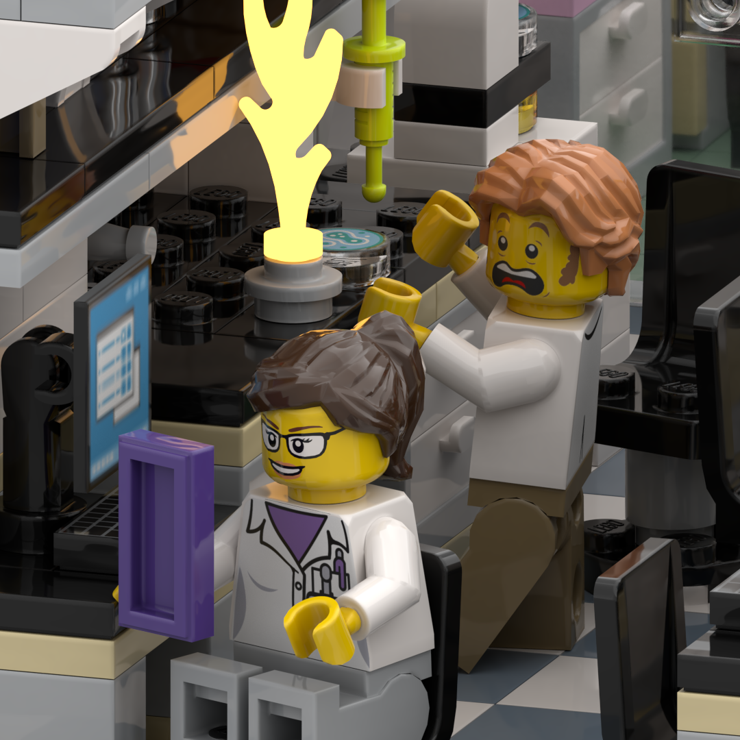 LEGO scene of a hospital or laboratory with two minifigures, one female with glasses and hair tied back, and one male with curly hair, both wearing white coats. The male is holding a yellow mug and appears alarmed, while the female is seated at a computer with a purple monitor. There is a test tube with green liquid and yellow flame or steam on a black countertop.
