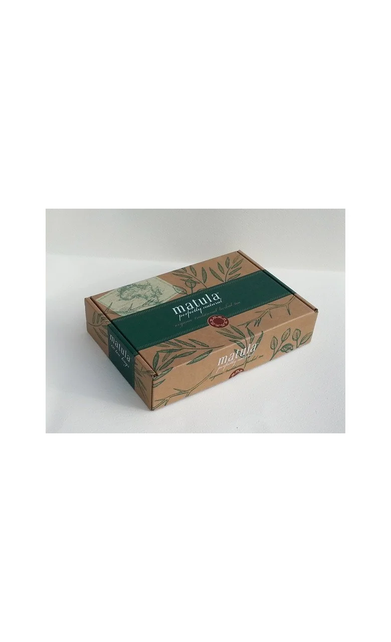 Cardboard box with green and brown design, labeled 'matula'