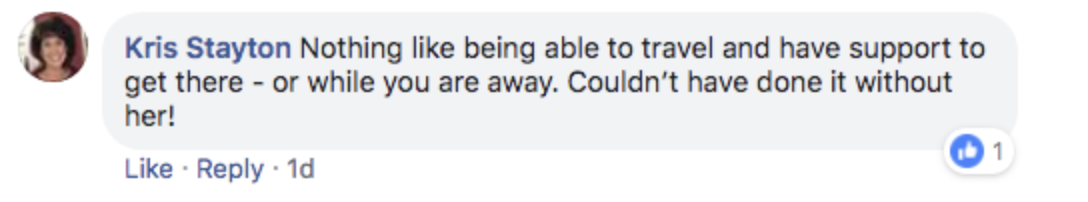 Facebook comment by a user named Kris Stayton, expressing gratitude for having support while traveling. The comment is liked by one person and includes options to like, reply, and check the time posted (1 day ago).