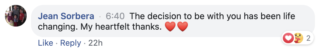 A Facebook comment from Jean Sorbera saying, "The decision to be with you has been life changing. My heartfelt thanks." followed by two heart emojis. The comment was made 22 hours ago. There are two reactions: a heart and a face with heart eyes, tota