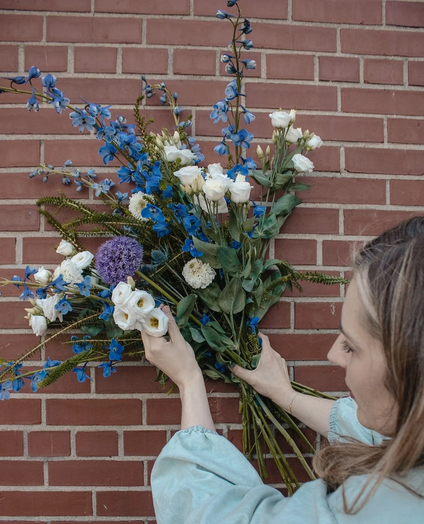 Creating a custom arrangement to make your day! Stop in and see us from 10-5 💐