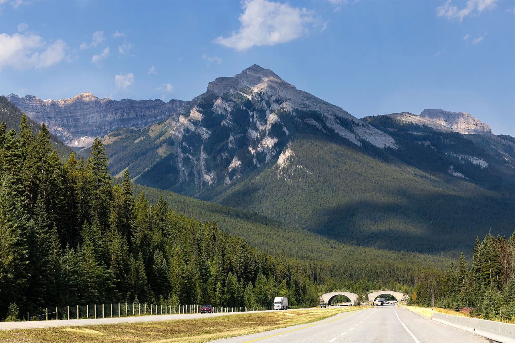 Scenic mountain landscape with highway and forest