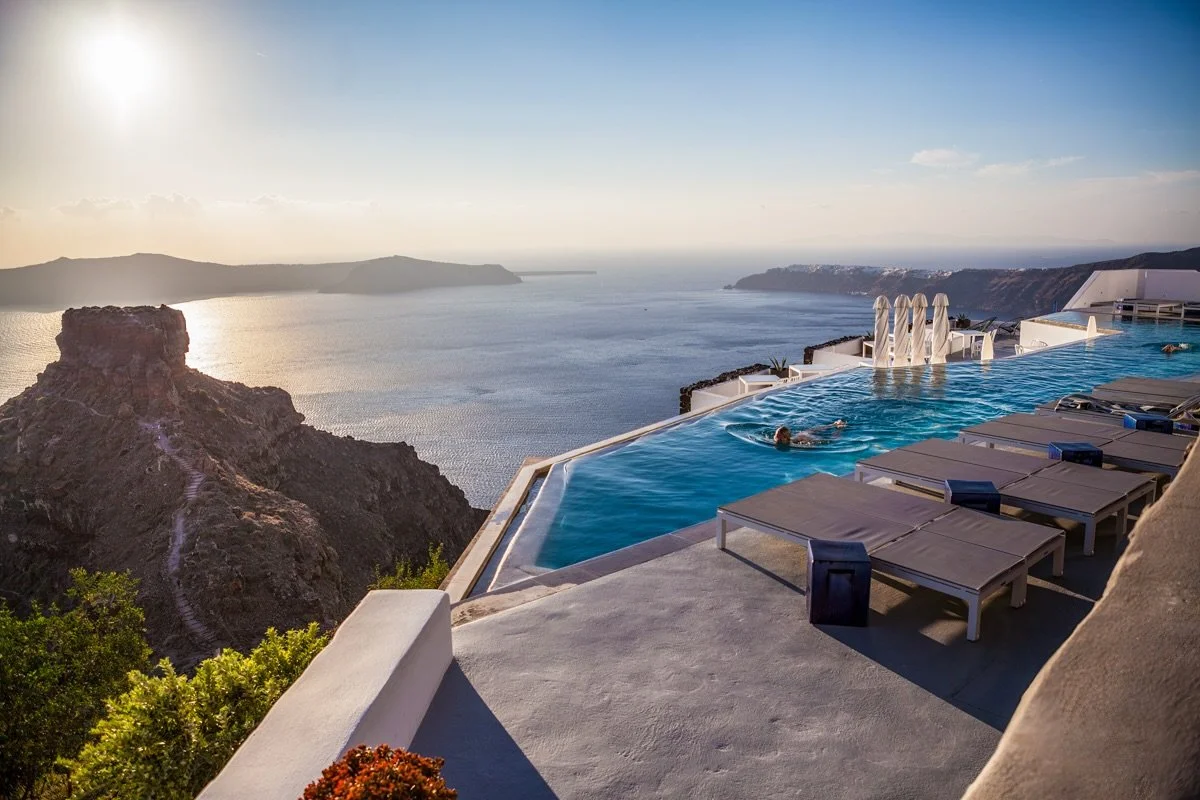 Dreaming in Santorini.

Imagine wandering through whitewashed villages and cobalt-domed churches, then returning to your home away from home&mdash;where sweeping views meet the largest infinity pool on Santorini.

Perched high above the caldera, the 