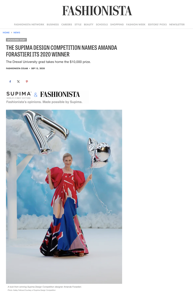 A woman standing outdoors in a colorful dress, holding silver helium balloons shaped like a bell and a heart, with large silver foil number balloons behind her and a cloudy blue sky in the background.