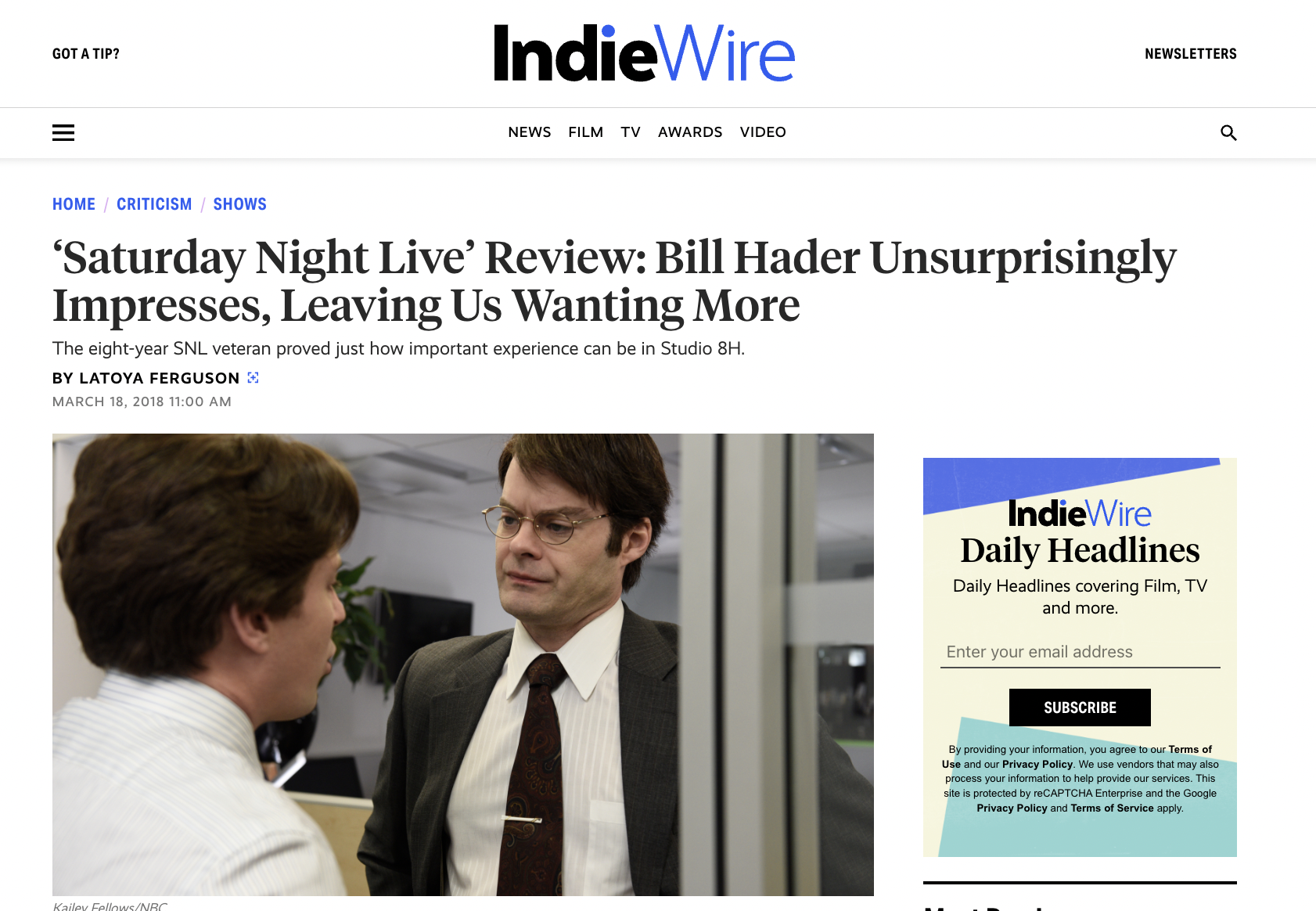 Screenshot of an IndieWire article titled ''Saturday Night Live' Review: Bill Hader Unsurprisingly Impresses, Leaving Us Wanting More' with a photo of two men in an office, one wearing glasses and a suit, the other with brown hair, talking to each other.