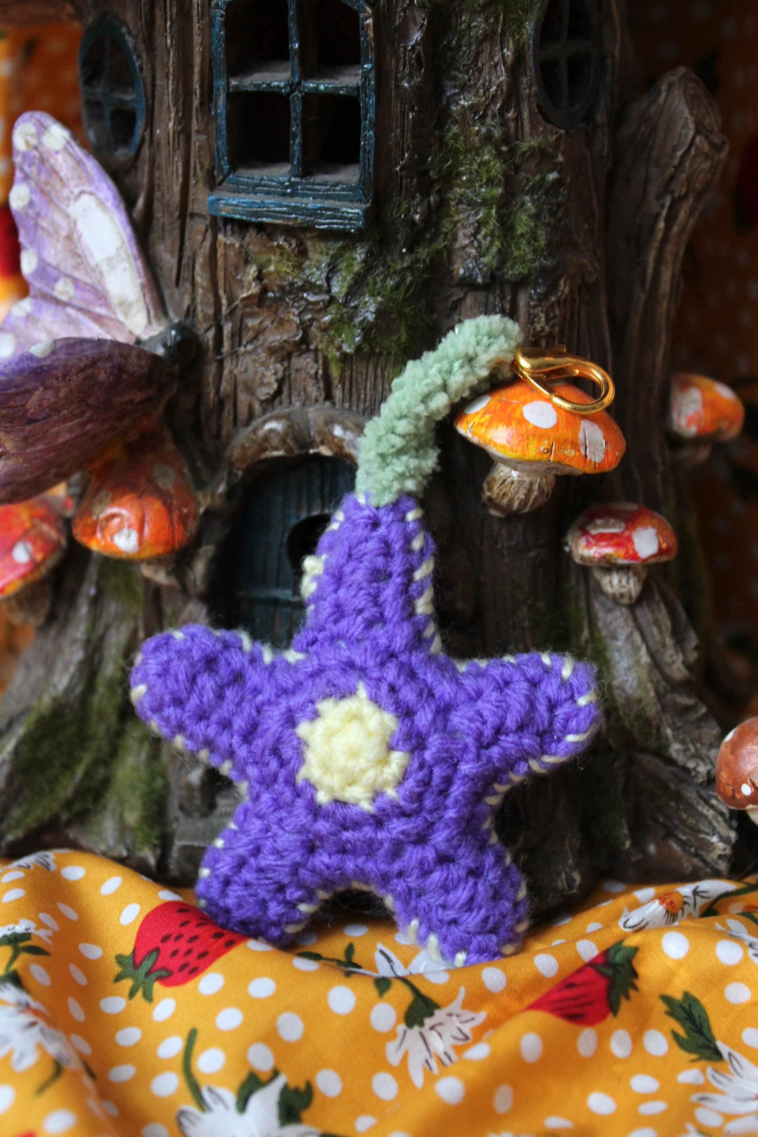 Small purple flower charm