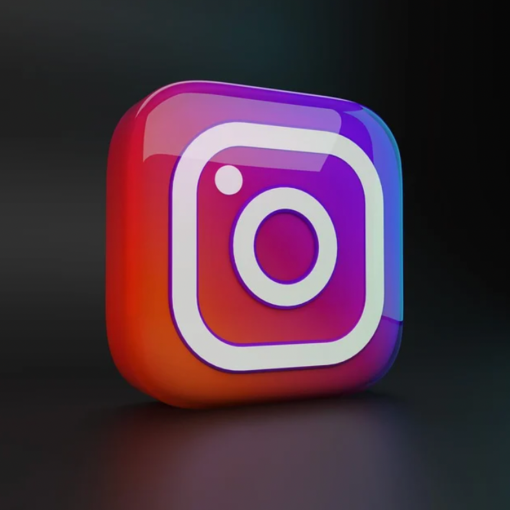 3D Instagram logo icon in gradient colors on a dark background.
