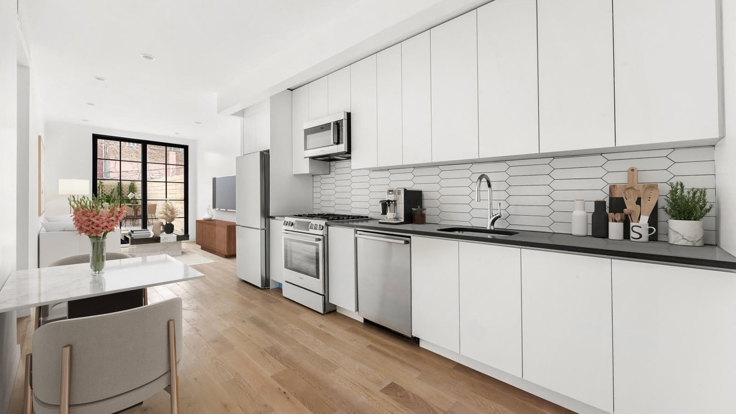 Modern kitchen and living room with white cabinets, stainless steel appliances, wood flooring, and minimalist decor.