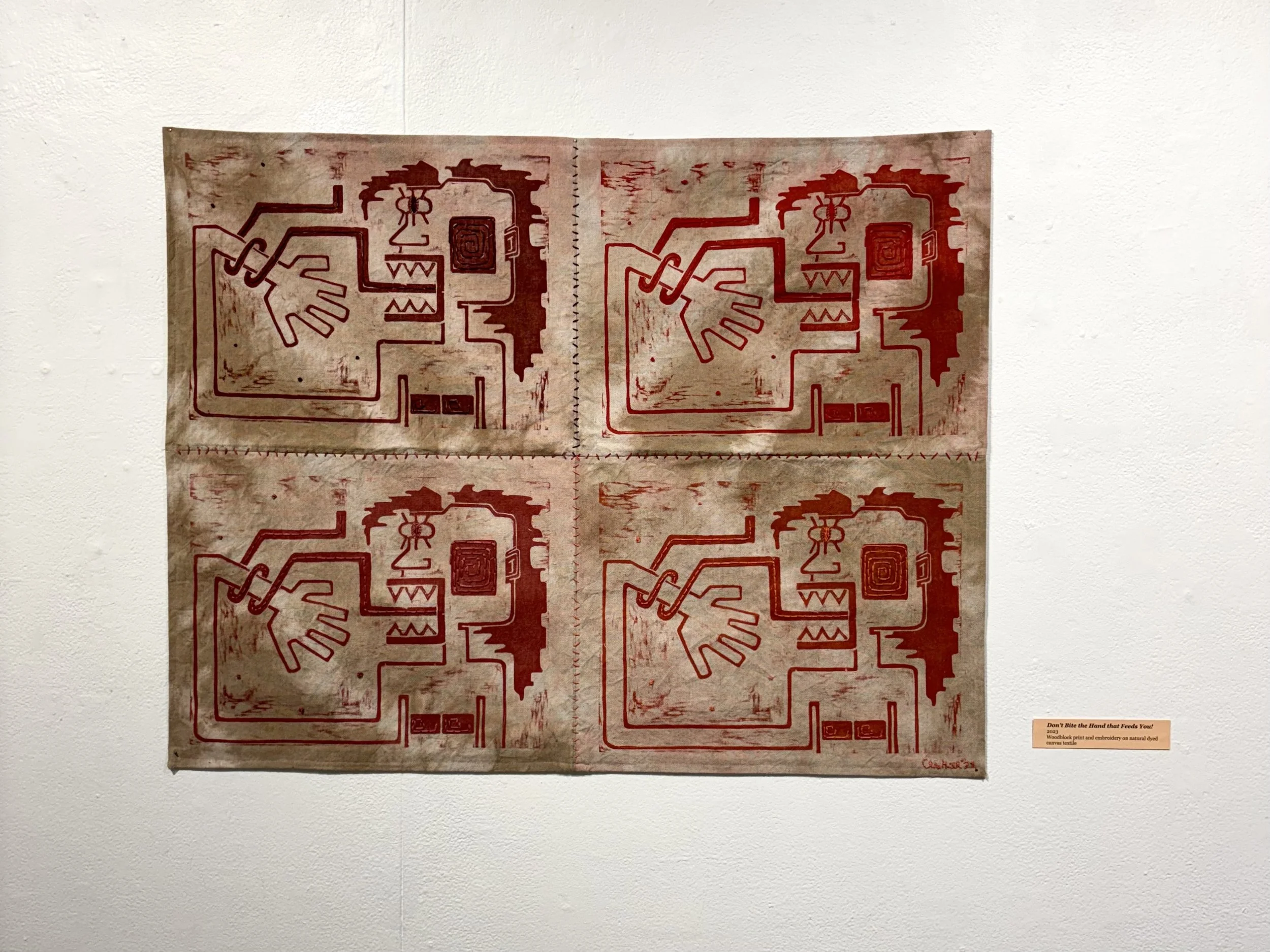 Don't Bite the Hand that Feeds You! | 2023 | woodblock prints and embroidery on naturally dyed canvas textile