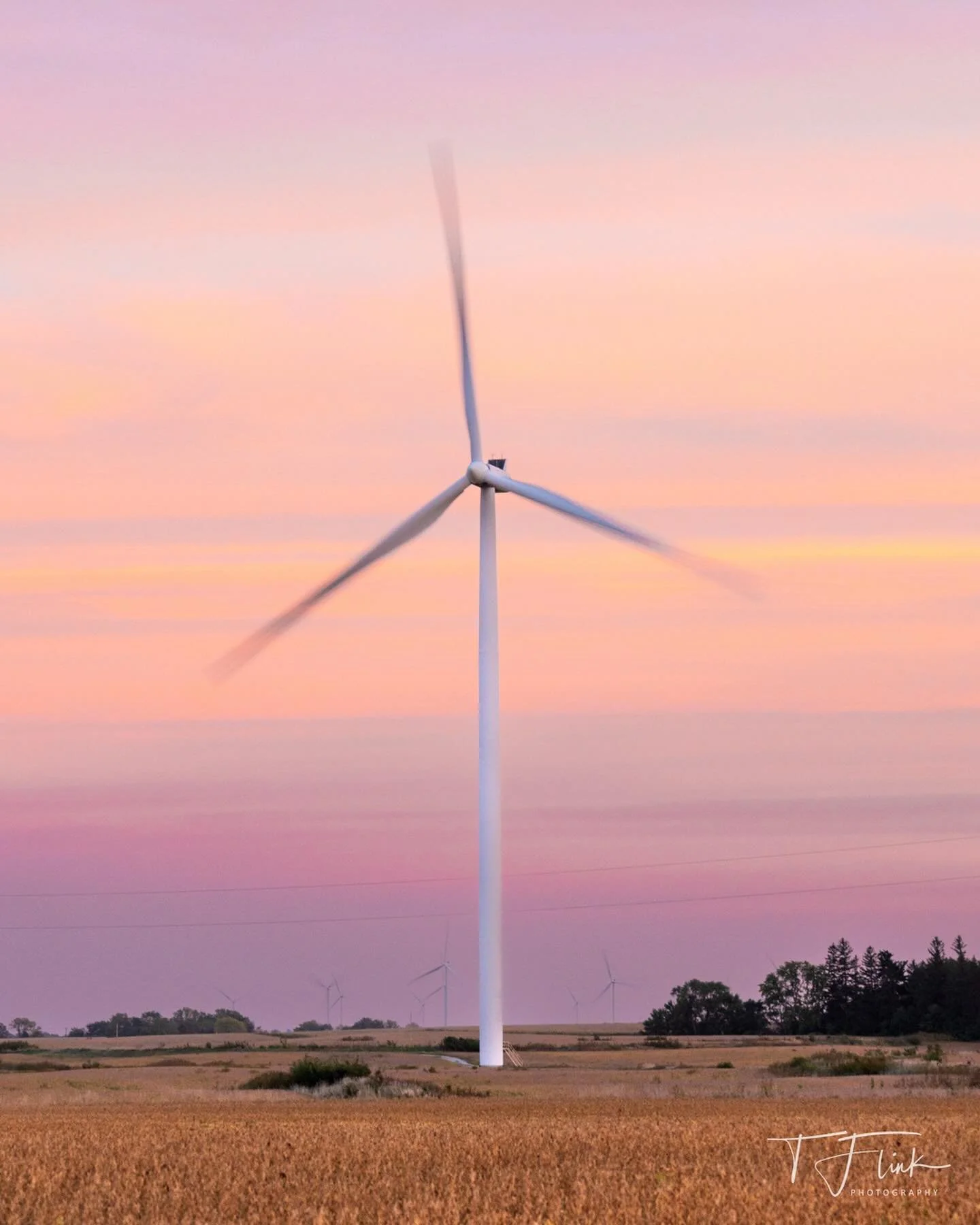 Chasing windmills and sunsets through the fields of Iowa.
