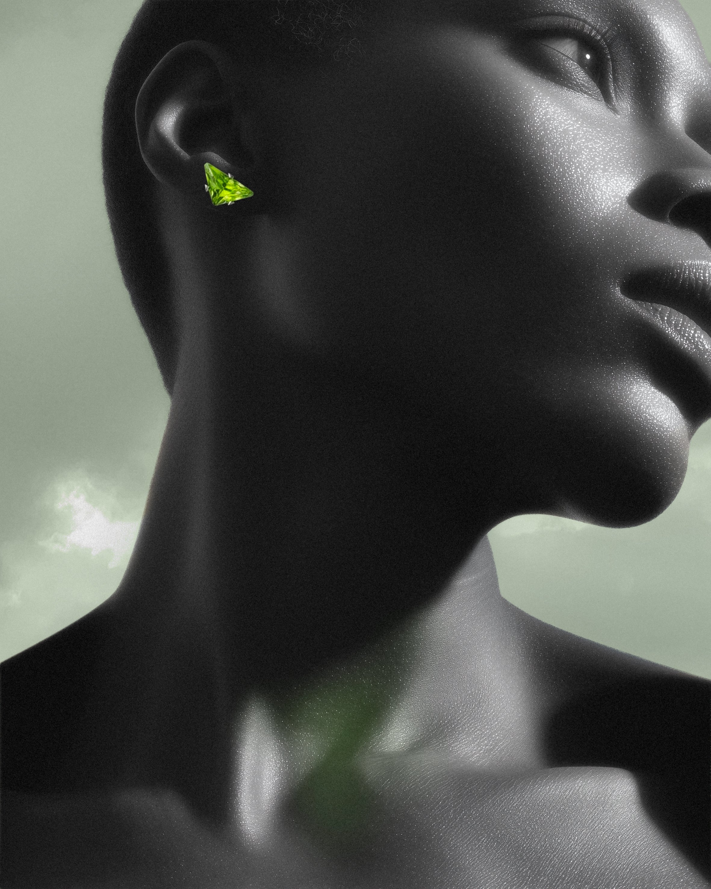 Close-up of a person's face and neck in black and white, wearing a green triangle-shaped earring, with a cloudy sky in the background.
