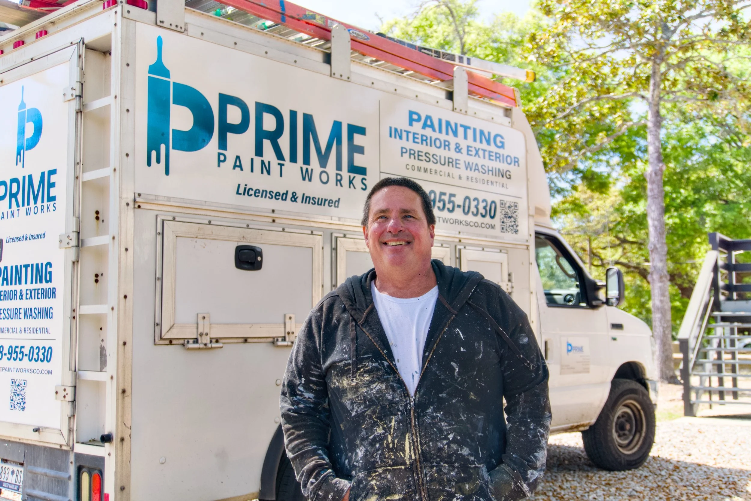 man standing in front of branded truck. John Gallagher. Prime Paintworks Co Truckl