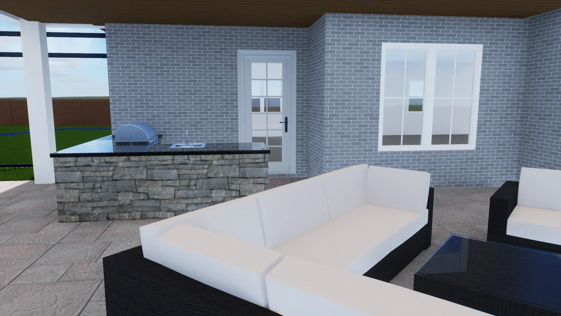 Outdoor patio area with white sectional sofa, black wicker chairs, glass-top table, stone counter with a barbecue grill, brick house wall, and large window and door.