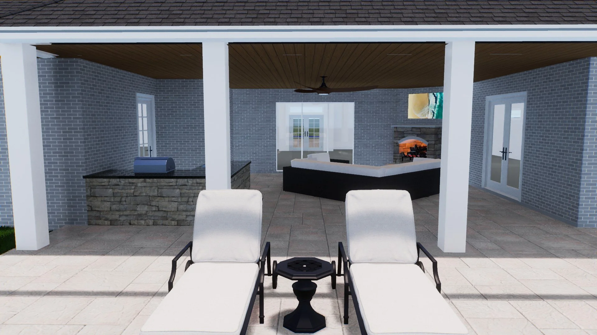 Patio area with two white lounge chairs and a small black side table in front, open to a covered outdoor living space with brick walls, a fireplace, and a ceiling fan, and sliding glass doors leading inside.