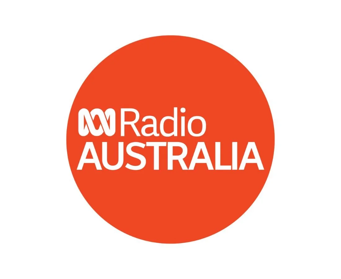 Radio Australia logo with an orange circle background and white text.
