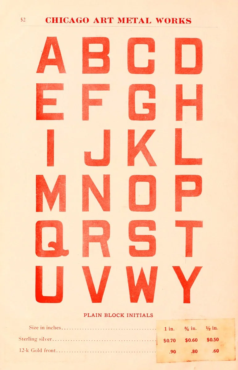 A vintage Chicago Art Metal Works advertisement displaying alphabet letters in bold red block initials, titled 'Plain Block Initials,' - it is the inspiration for the ANFCo Plain Grave font.