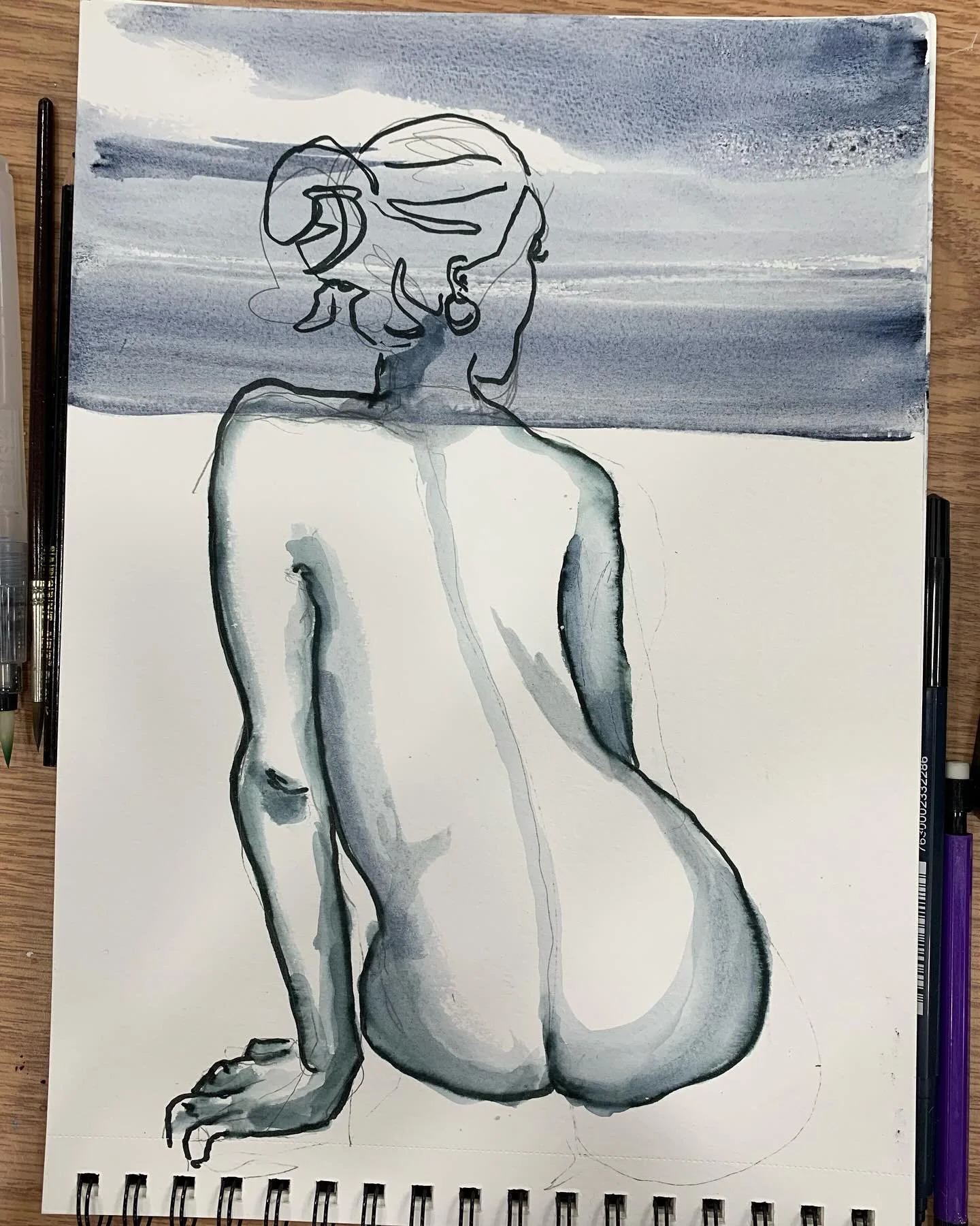 Using already painted watercolor paper found in studio dumpster for quick sketch. #watercolorpainting #lifedrawing #chicagoartists