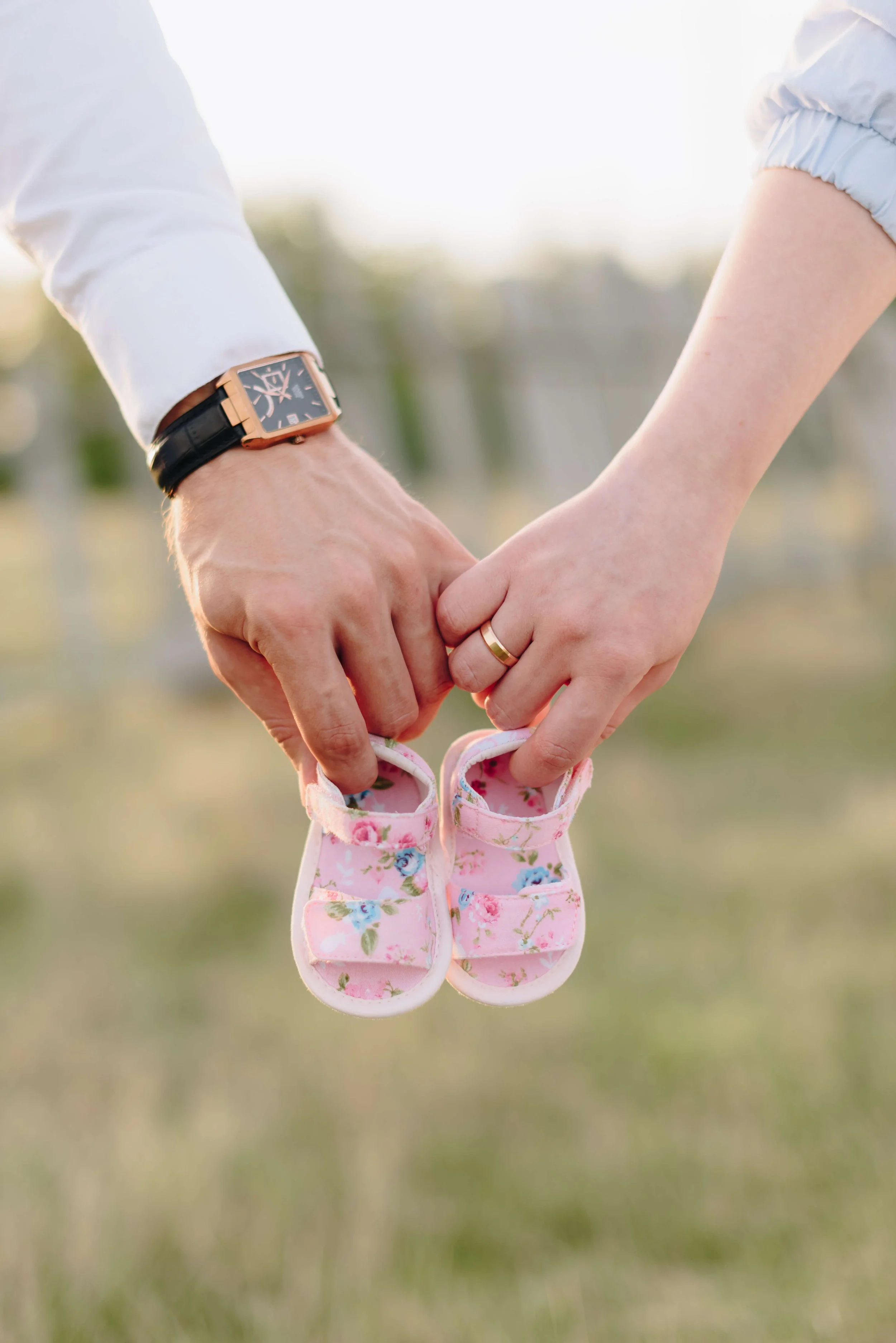 maternity photoshoot newborn shoes mom and dad