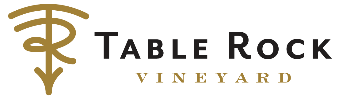 The logo of Table Rock Vineyard, featuring a stylized tree and the company name with the word 'Vineyard' underneath.